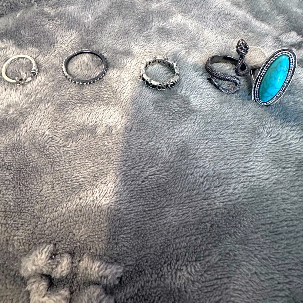 Assorted silver tone and turquoise rings